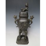 AN EARLY 20TH CENTURY ORIENTAL BRONZED KORO AND COVER, the cover with dog of fu, stylised floral