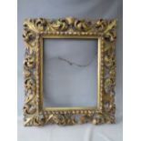 A LATE 18TH / EARLY 19TH CENTURY CARVED WOODEN FLORENTINE GOLD FRAME, with integrated gold slip,