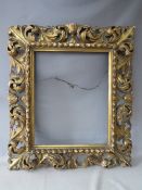 A LATE 18TH / EARLY 19TH CENTURY CARVED WOODEN FLORENTINE GOLD FRAME, with integrated gold slip,