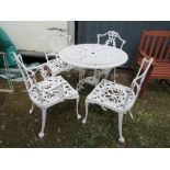 A WHITE PAINTED CAST ALLOY PATIO TABLE AND FOUR CHAIRS