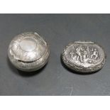 A HALLMARKED SILVER LIDDED PILL / SNUFF BOX TOGETHER WITH ANOTHER EMBOSSED EXAMPLE WITH MARKS TO