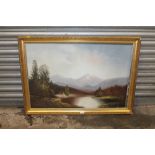 A LARGE GILT FRAMED OIL ON BOARD OF A MOUNTAINOUS RIVER SCENE - SIGNED LOWER RIGHT CAMPBELL