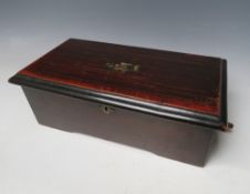 A SWISS MUSIC BOX, the simulated rosewood case opening to reveal a small 31/2" cylinder stamped M F,
