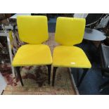 A PAIR OF MODERN YELLOW DINING CHAIRS