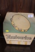 A VINTAGE BOXED 10" TAMBOURINE