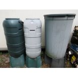 THREE PLASTIC GARDEN WATER BUTTS ON STANDS