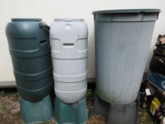 THREE PLASTIC GARDEN WATER BUTTS ON STANDS