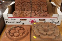 A SELECTION OF SIX ASSORTED VINTAGE TERRACOTTA PATTERNED TILES
