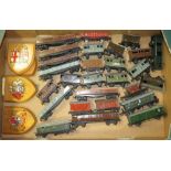 A BOX CONTAINING VARIOUS HORNBY / TRIX MODEL RAILWAY TRUCKS, coaches and various wooden railway