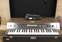 A KORG POLYPHONIC ENSEMBLE ORGAN / SYNTHESIZER IN CASE - MODEL PE-2000 COMPLETE WITH PEDAL