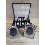 A CASED SET OF HALLMARKED SILVER TEASPOONS - SHEFFIELD 1931, together with two small modern photo