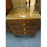 A SMALL CARVED EASTERN THREE DRAWER CABINET WITH GLASS TOP H-56 W-49 CM