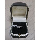 A HALLMARKED 18 CARAT WHITE GOLD OVAL DIAMOND SOLITAIRE RING, the central diamond being an