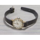 A VINTAGE LADIES OMEGA WRISTWATCH ON LEATHER STRAP