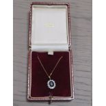 A 9CT GOLD SAPPHIRE PENDANT NECKLACE