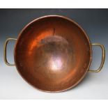 A LARGE BRASS AND COPPER TWIN HANDLED DOMED BOWL, H 24 cm, Dia. 70 cm