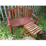 A HARDWOOD GARDEN BENCH AND TABLE