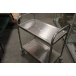 A STAINLESS STEEL SERVING TROLLEY