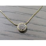 A LADIES YELLOW METAL DIAMOND SET PENDANT ON A 750 MARKED CHAIN