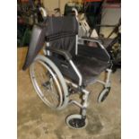 A CARE CO FOLDABLE WHEELCHAIR