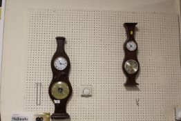 TWO WALL HANGING CLOCK BAROMETERS