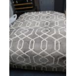 A MODERN WOOLEN RUG WITH A LATTICE DESIGN 160 X 230 CM