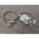 A LADIES 10K GOLD SINGLE CITRINE SET RING TOGETHER WITH A SIMILAR 9CT EXAMPLE (2)