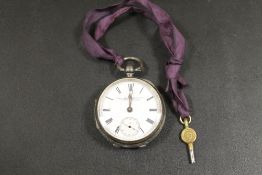 A HALLMARKED SILVER OPEN FACED MANUAL WIND POCKET WATCH BY THE LANCASHIRE WATCH COMPANY LIMITED