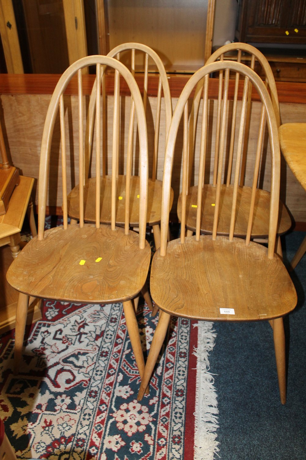 A SET OF FOUR ERCOL STYLE STICKBACK DINING CHAIRS