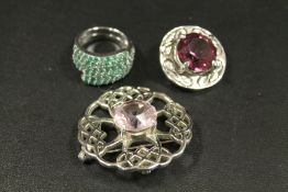 A GEM SET SILVER RING STAMPED 925 TOGETHER WITH TWO CELTIC THEMED BROOCHES