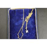 A HALLMARKED 10ct GOLD PENDANT AND CHAIN WITH DIAMOND CLUSTER