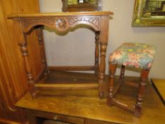 A CARVED OAK OCCASIONAL TABLE TOGETHER WITH A SMALL OAK STOOL (2)