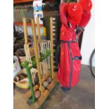 A GARDEN CROQUET SET TOGETHER WTIH VINTAGE GOLF CLUBS