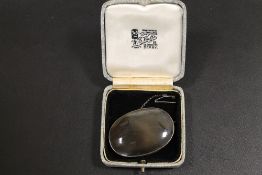 A LARGE ANTIQUE SILVER MOUNTED AGATE BROOCH