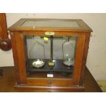 A CASED SET OF CHEMISTS BALANCE SCALES