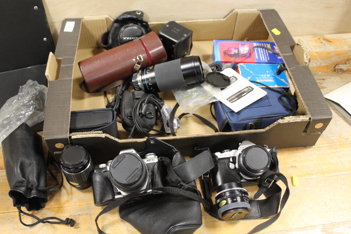 A TRAY OF CAMERAS. LENSES AND ACCESSORIES