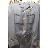 A VINTAGE R.A.F. UNIFORM - TAILORED IN CANADA WITH UNUSUAL BRASS 'CANADIAN GOOSE AND KINGS CROWN'