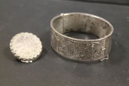 A CHESTER HALLMARKED SILVER CLASP BANGLE TOGETHER WITH A BROOCH