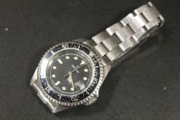 A MENS STAINLESS STEEL DIVERS WATCH BY GROVANNA WITH SWISS RONDA JEWELLED MOVEMENT