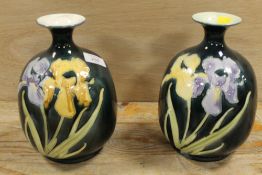 A PAIR OF TUBELINED FLORAL VASES DECORATED WITH IRISES