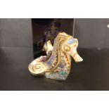 A ROYAL CROWN DERBY PAPERWEIGHT IN THE FORM OF A PAPTIM SEAHORSE - WITH BOX