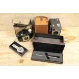 A CASED DUNHILL PEN WRISTWATCH AND TWO BOXED CAMERAS