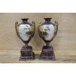 A PAIR OF LATE 19TH / EARLY 20TH CENTURY PORCELAIN VASES WITH LANDSCAPE CARTOUCHES
