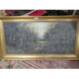 A GILT FRAMED OIL ON CANVAS OF A WOODED LANDSCAPE SIGNED LOWER LEFT