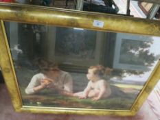 A FRAMED AND GLAZED PRINT OF A MOTHER AND CHILD