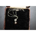 A 9ct WHITE GOLD DIAMOND AND PEARL PENDANT NECKLACE