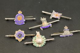 SIX MILITARY SILVER AND ENAMEL BAR BROOCHES