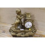 A GILT METAL MANTLE CLOCK WITH FIGURE OF GIRL READING A BOOK A/F