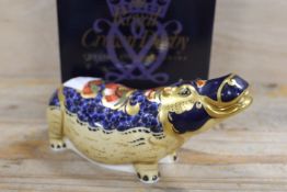 A ROYAL CROWN DERBY PAPERWEIGHT IN THE FORM OF A HIPPOPOTAMUS - WITH BOX