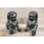 A PAIR OF BRASS CLOISONNE ENAMEL EMBELLISHED SEATED DOGS OF FO